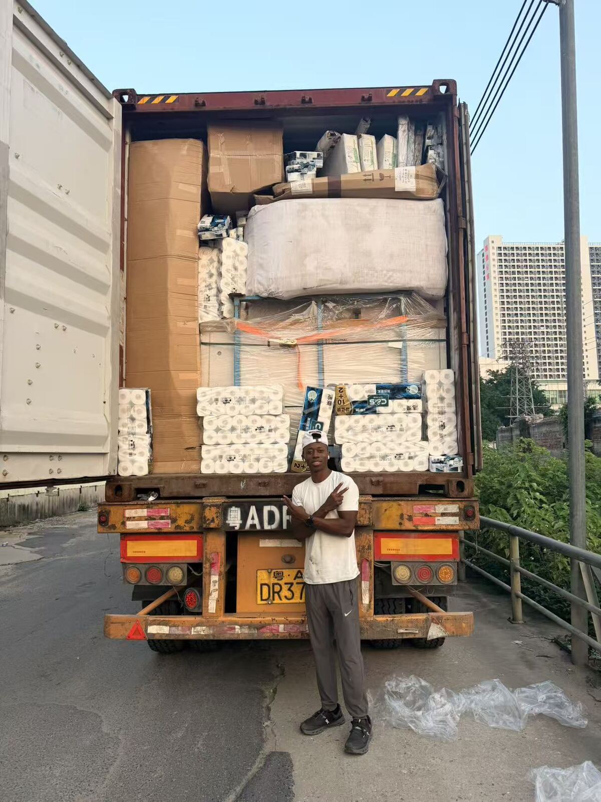 Standing at the back of a fully loaded shipping container after a completed loading day